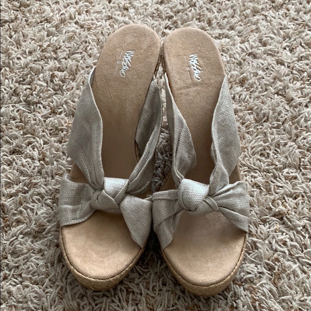 Wedge heels. Never worn! Silver shimmery color.